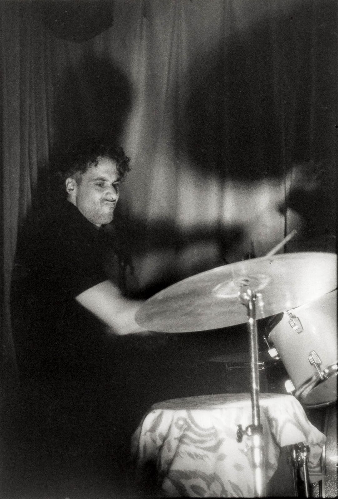 Osman Meyredi at the drum kit, black and white